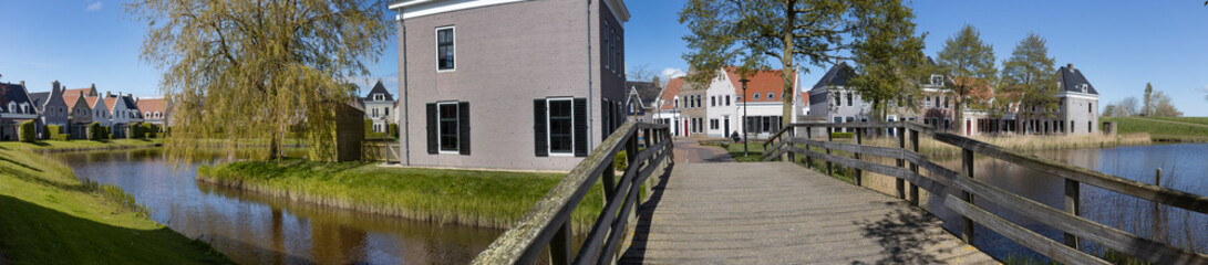 Bridge and canal at Eson Stad. Eson city. Friesland Netherlands. Replica city. Panorama. Lauwerszee. Lauwersoog. Holliday park.