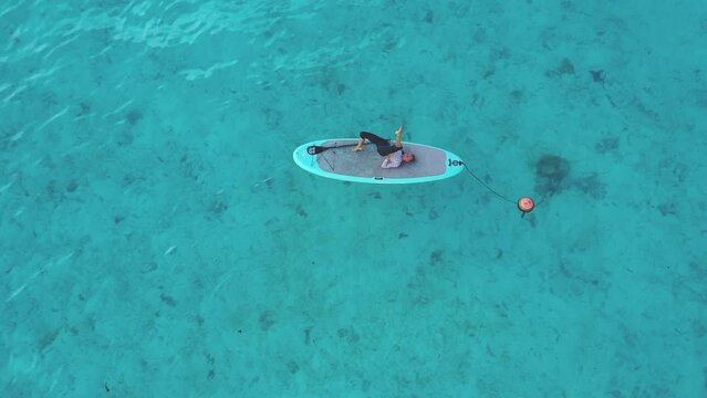 Aerial view of turquoise waters surrounding Thoddoo Island, Alif Dhaal, Maldives.