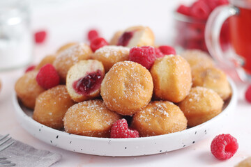 A plate wit traditional berliner cakes with jelly	