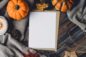 Flatlay of Halloween blank white paper greeting card menu invitation rsvp POD mock up pumpkin fabric wood backdrop for farmhouse cozy boho fall background empty cardstock note invite above view