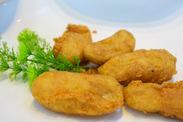 Delicious battered fish on a plate with chips fish and chips with french fries unhealthy food battered fish