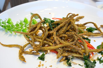 Deep Fried Minnow Fish with Salt and Sugar Fried Horse Face Loach or Fish fried banana root with garlic and black pepper