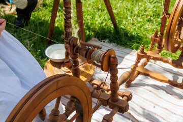 A spinning wheel on which flax fibres are spun into threads