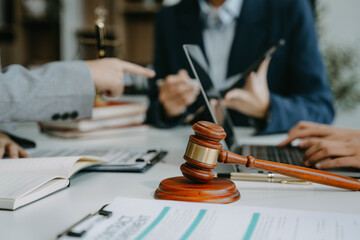Teamwork of business lawyer meeting working hard about legal legislation in courtroom to help their customer.
