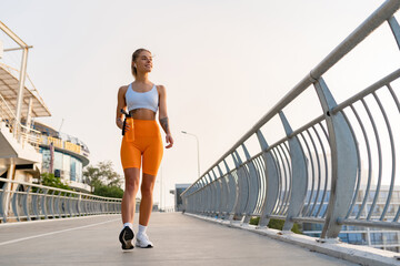 pretty young smiling woman doing sports in the morning in stylish sport outfit sportswear, skinny...