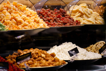 Assorted dried fruits and sweets on display