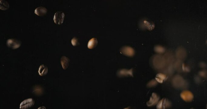 Coffee beans falling from below, slowmotion low angle 4K pro res