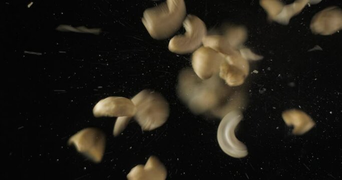 Coffee beans falling from below, slowmotion low angle 4K pro res