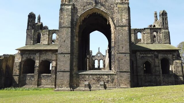 The famous Kirkstall Abbey showing the ruined Cistercian monastery in Kirkstall in the north-west of Leeds city centre in West Yorkshire in the UK on a bright sunny summers day.