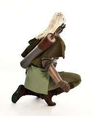 full length portrait of blonde female model wearing green fantasy elf warrior halloween costume...