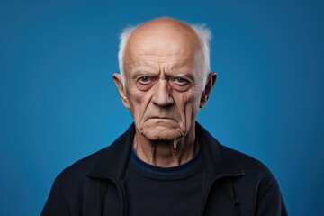 Blue background sad european white man grandfather realistic person portrait older person beautiful bad mood old man Isolated on Background 