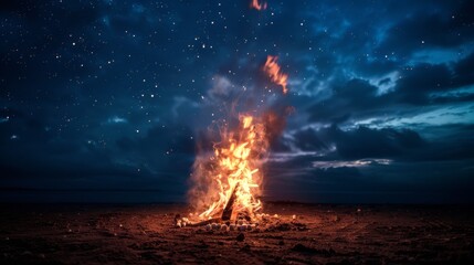 Obraz premium Vibrant Bonfire on a Starry Night Beach Capturing Mystical Outdoor Serenity