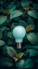 Eco friendly light bulb cradled by green leaves symbolizing sustainable energy in a blue tinted world