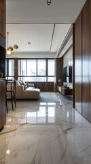 modern living room with a compact kitchen, adorned with white marble flooring, complemented by earth-tone furniture such as a comfortable sofa and a small dining table.