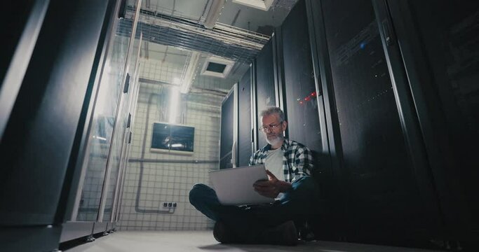 Man Sitting in Server Room