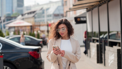 Business woman with phone in summer 
