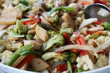 Stir-fried vegetables. Mixed vegetables of carrot, broccoli, mushroom,  capsicum, and chicken meat.