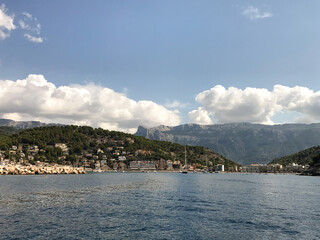 Fototapeta premium Picturesque bay of the port of the old sea town with low-rise buildings and yachts at the pier