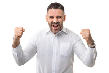 A man wearing a white shirt is standing with his fists raised in a defensive position. He appears...