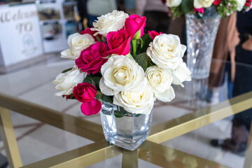 Roses bouquet in hotel lobby, fresh flowers in vase