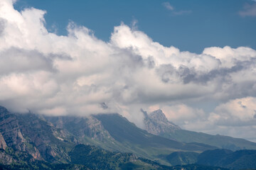 Clouds cover the peaks of the mountains. View of the Caucasus Mountains in Ingushetia, Russia