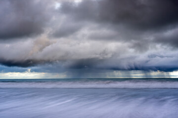 Storm clouds over the ocean viewed from Playa El Almejal, Bahia Solano, Choco, Colombia, Pacific Ocean. July, 2022. 