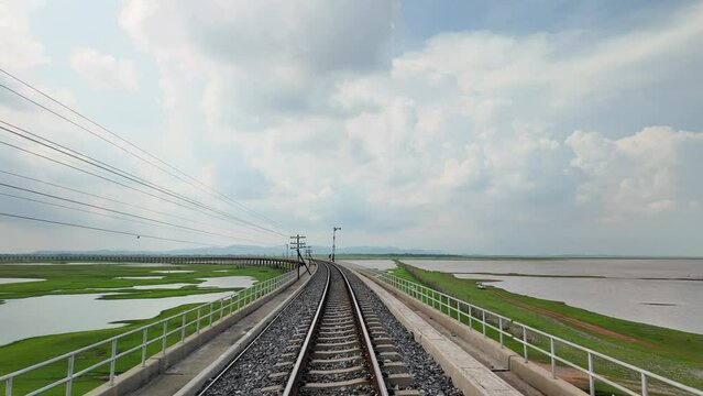 Floating railway tracks over Pasak Cholasit Dam in the dry season, Lopburi Province.pan motion