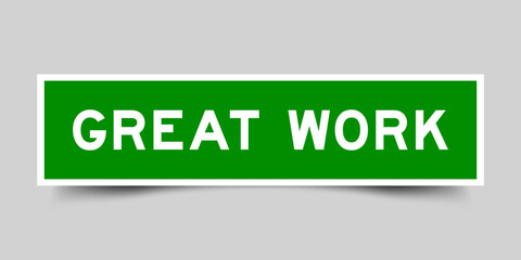 Green color square shape sticker label with word great work on gray background