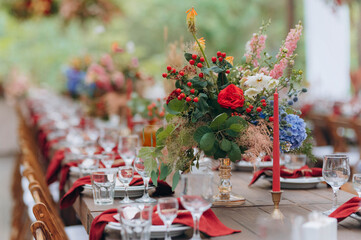 wedding holiday banquet in the open air. covered, served tables in the yard, garden in nature. wooden tent covered with fabric, wedding banquet