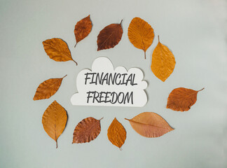 A circle of leaves with the word financial freedom written in the center