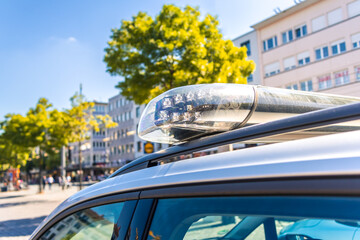 Detail of German police car with blue light  in a city