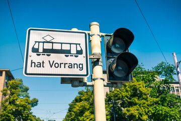 German traffic sign with 'Tram has priority' with traffic lights
