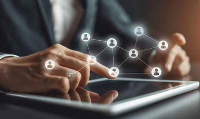 A businessman using a digital tablet to manage customer relationships, featuring a virtual network overlay of interconnected icons, representing CRM and global communication