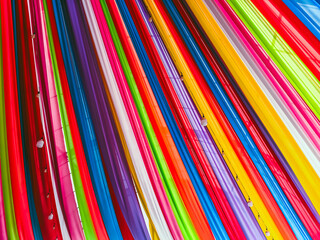 Rainbow cloth roof. Abstract image of tent roof fabricated from multicolored fabric. Colorful fabric in the festival. Multicolored backgrounds from fabrics of different colors, textured with patterns.