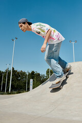 A young man glides effortlessly down the side of a ramp on his skateboard in a bustling outdoor...