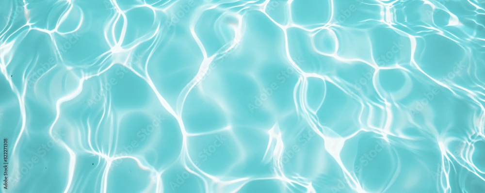 Wall mural turquoise pool water background, summer background, sunlight reflections, sparkling ripples, swimmin