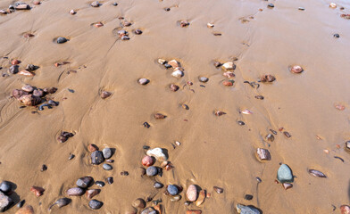 Colored Pebble Beach Texture Background, Sand and Rocky Shore Pattern, Red Morocco Beach, Africa