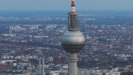Breathtaking aerial shot of Berlin's famous TV tower set against the city's impressive skyline at dusk