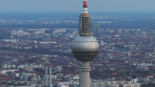 Breathtaking aerial shot of Berlin's famous TV tower set against the city's impressive skyline at dusk