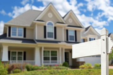 White sign in front of a house that says home, real estate concept