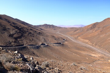 Desert mountain landscape surrounding Entallada lighthouse overlooking the ocean, Fuerteventura, Canary Islands, Spain, Atlantic, Europe