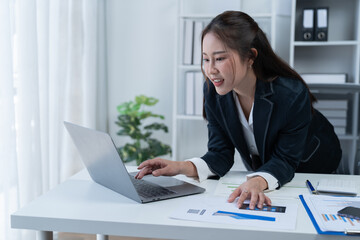 Happy businesswomen working at the office 