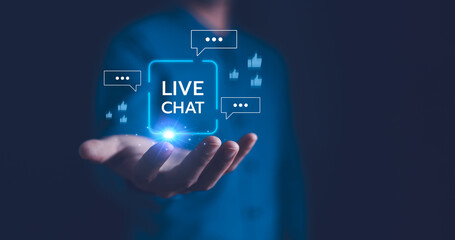 A close-up of a man's hands holding a smartphone, with Live Chat online communication and customer service technology, Chat with AI, Artificial Intelligence. Futuristic technology transformation.