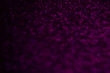 A purple background with many small hearts scattered throughout