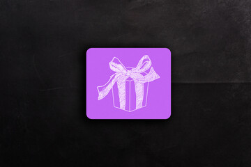 A purple box with a bow on it