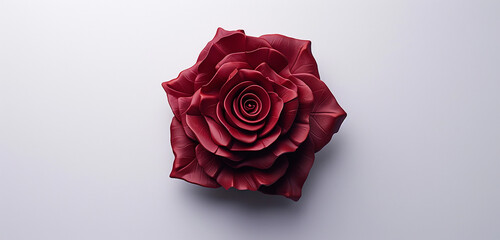 A high-definition rose logo with realistic petal textures and a deep, rich red color, highlighted against a white backdrop. - Powered by Adobe