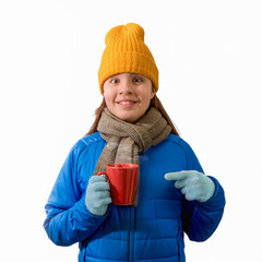 A joyful teenage girl with a cup in winter clothes on a white background. banner