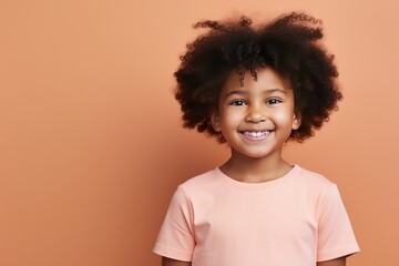 Tan background Happy black american african child Portrait of young beautiful kid Isolated on Background ethnic diversity equality acceptance 