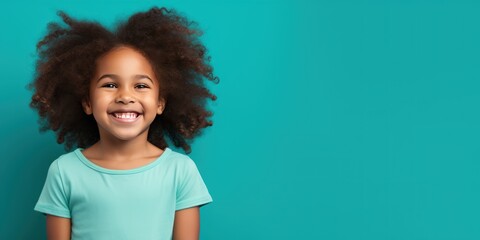 Teal background Happy black american african child Portrait of young beautiful kid Isolated on Background ethnic diversity equality acceptance 