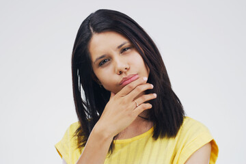 Girl, hand and portrait of idea in studio for personal development, contemplation and thoughts of introspection. Female person, doubt and mindfulness for future career, isolated and white background.